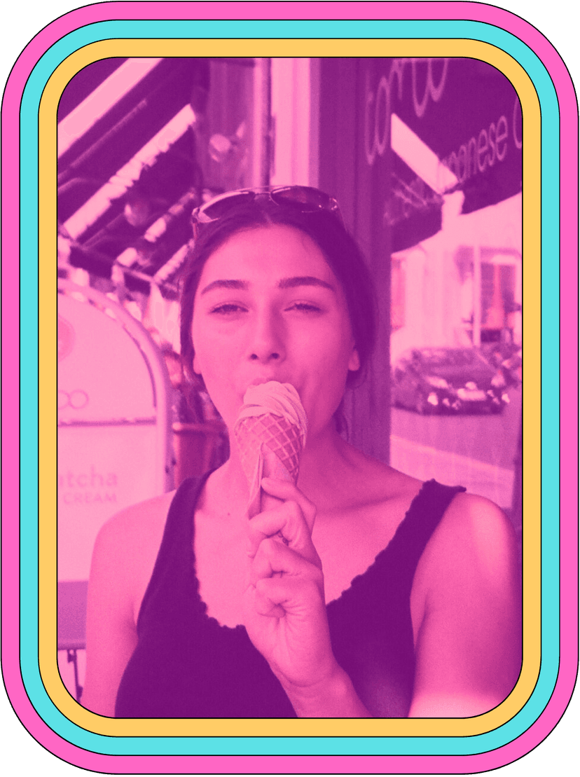 A colorful headshot of Anca, eating an icecream.